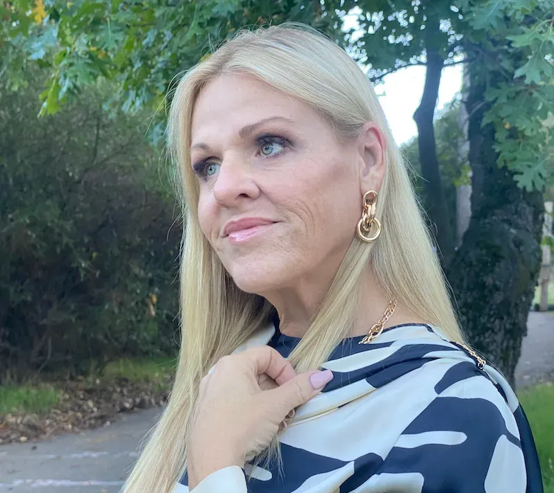 Julie head shot in the woods